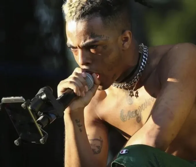 XXXTENTACION face tattoos showing broken heart, numb, and alone symbolism